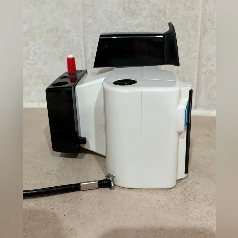 Vintage Polaroid Swinger camera and case